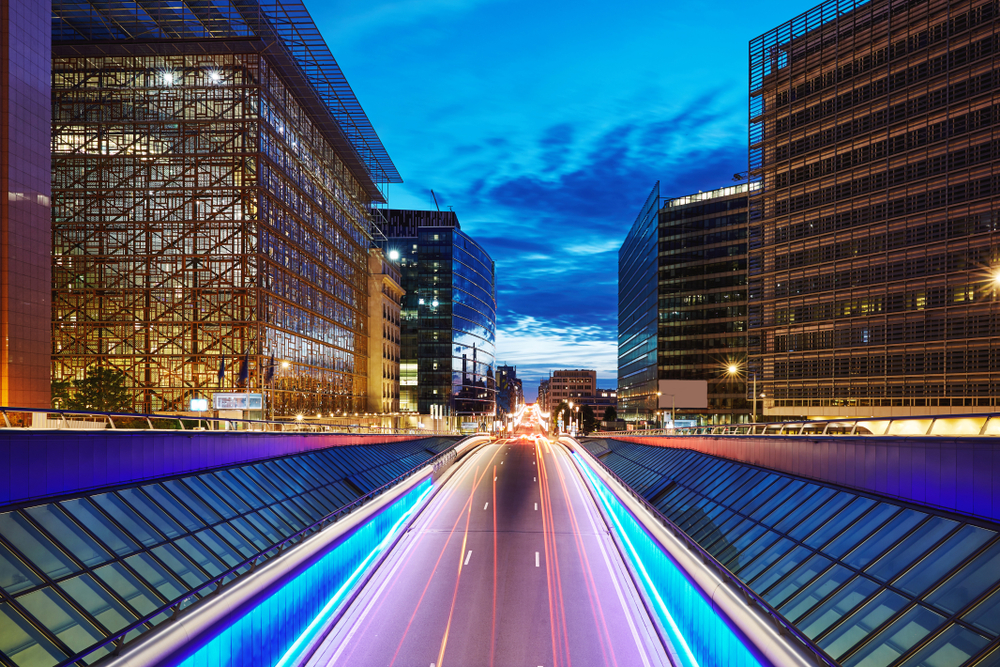 Long exposure shot of a central street at blue hour. Skyscrapers on background. Brussels, Belgium