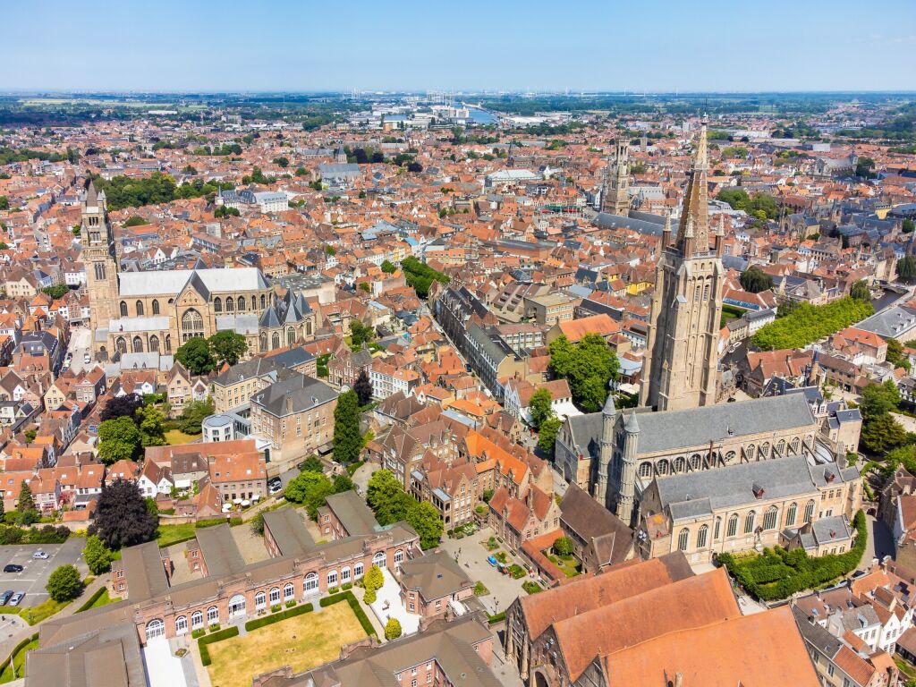 Aerial drone cityscape with the Notre Dame (Our Lady) church of Bruges and the St. Salvator's Cathedral (Saint Savior), the Roman Catholic cathedral and main church of Bruges, Belgium. 