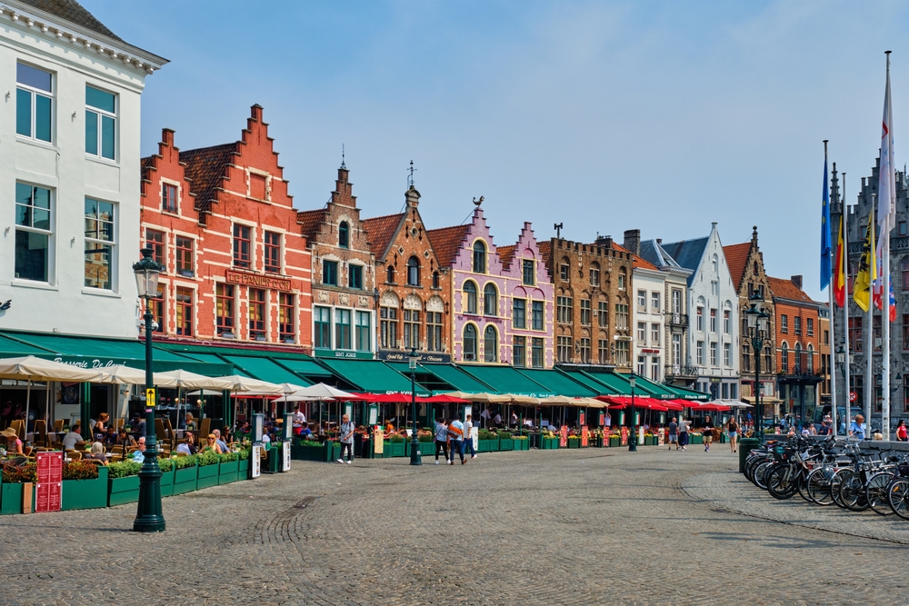 Bruges, Belgium - May 29, 2018: Bruges Grote markt square famous tourist place with many cafe and restaurants